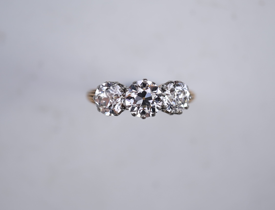 An attractive three-stone diamond ring, early 20th century